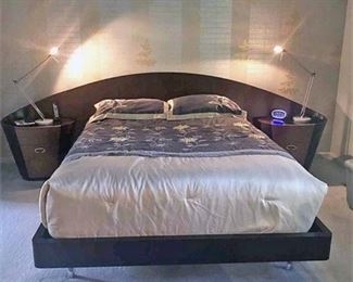 Custom Made Bed solid wood bed with Attached Night Stands on either Side. Black and Dark Wood Tone with Curved Design. Very Modern. Please note that this does not include the mattress, Bed Spread or any of the items seen on the night stands. This is for the Bed Set Only. 