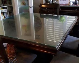 Dining Table with 4 chairs and glass table top protector.
