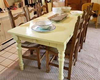 Painted dining table with drawer on each end and a set of eight matching side chairs