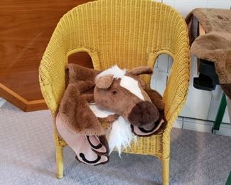 Wicker armchair with a horse rug