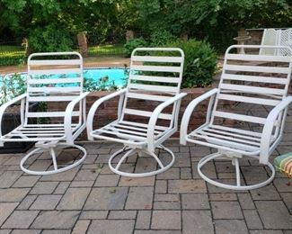Three swivel rockers without cushions