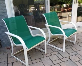 Set of four green and white sling armchairs