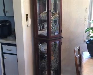 mirrored pentagonal corner curio lighted with glass shelves