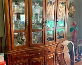 China cabinet full of glass and crystal items