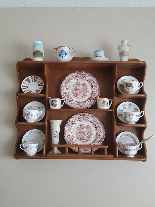 Assorted cups and saucers and decorative shelf