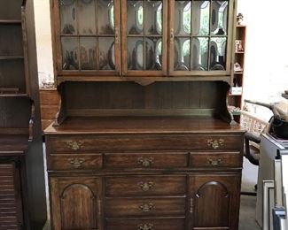 Pennsylvania House cherry sideboard and hutch with bowed glass.