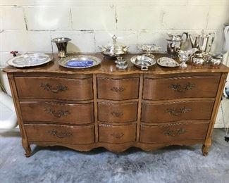 Sideboard by West Michigan Furniture Co.; selection of silverplate dinnerware/accessories.