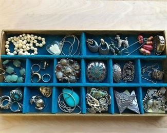 Wonderful selection of jewelry, both fine and costume.  Vintage sterling charm bracelets, numerous Mexican sterling pieces, gold class ring, much more.