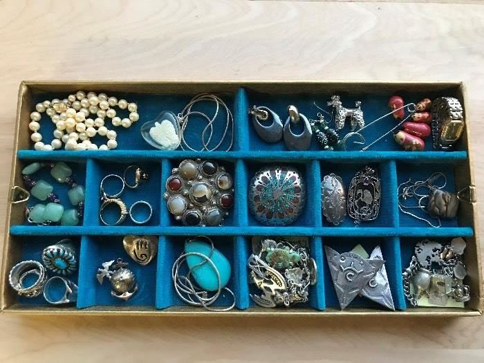 Wonderful selection of jewelry, both fine and costume.  Vintage sterling charm bracelets, numerous Mexican sterling pieces, gold class ring, much more.
