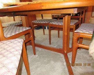 $800.00 DYRLUND TEAK TABLE HAS 6 MATCHING CHAIRS AND TWO TABLE EXTENSIONS, ASKING $800.00