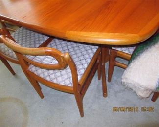 $800.00 DYRLUND TEAK TABLE HAS 6 MATCHING CHAIRS AND TWO TABLE EXTENSIONS, ASKING $800.00