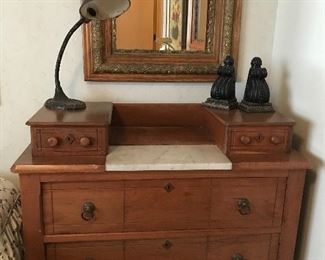 Walnut gentleman’s dresser with marble insert.