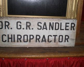 hand painted wood chiropractor sign