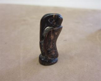 Miniature bird carved from horn.  1.25"