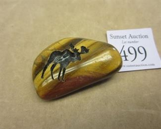Tiger's eye stone with cut in moose pattern