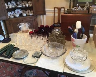 Various glass bowls, Waterford crystal glasses, silver chest, set of everyday drinking glasses. Candles and candle holders. 