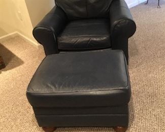 Navy blue leather chair and ottoman. 