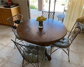 Solid oak kitchen table with 4 chairs.  This also has 2 bar chairs and a desk chair to match!