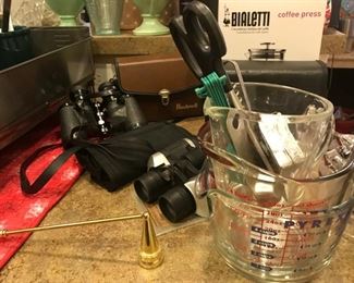 Pyrex measuring cups, Bialetti coffee press in box, Bosch and other pairs of binoculars, more