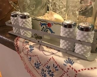 Spice rack, embroidered kitchen linens, milk glass salt and peppers, pattern glass pitchers