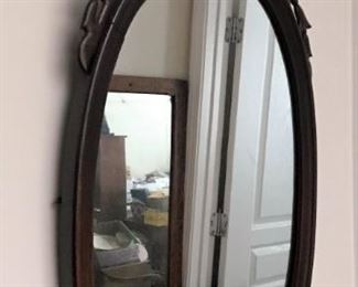 Ornate oval wall mirror