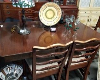1920's 5' Solid mahogany dining room table with built in leafs & 6 chairs