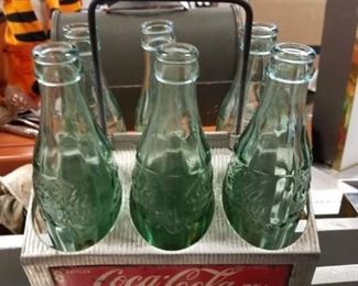 Vintge 1950's Coca Cola aluminum 6 bottle caddy with assorted state oriented mini bottles