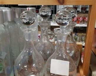 Assorted wine decanters with stoppers