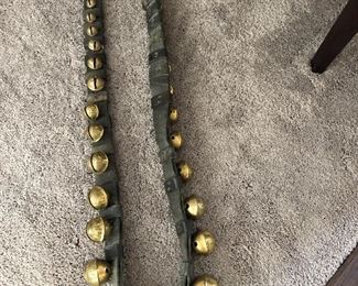 Antique brass horse bells on leather strap about 8 ft long