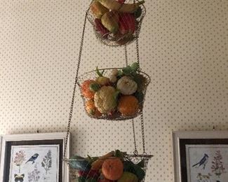 vintage fruit basket. cute framed bird prints in the background
