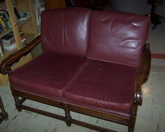 1930s OAK SETTEE WITH BURGUNDY LEATHER CUSHIONS BY JAMESTOWN LOUNGE  "FEUDAL OAK"  REALLY NICE!!  HAS TWO MATCHING CHAIRS.  SOLD AS A SET.