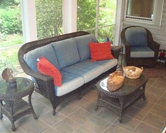 Screened Porch: High quality "wicker" furniture was originally purchased at AMINI's in Chesterfield. Each piece is separately priced: a round side table with protective glass top; a 78" three-cushion sofa; a swivel arm chair; and an oval coffee table with protective glass top. The cushions are detached; the next photos show the sofa and chair without the cushions. It actually looks much better than the photos!