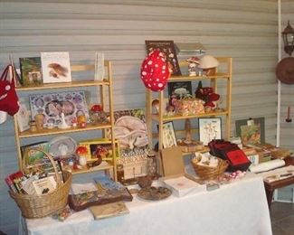 Screened Porch: Fun mushroom-theme novelties, books, and reference materials are displayed. The proceeds from the sale of anything mushroom related are being donated to the Missouri Mycological Society by Maxine. Some closer photos follow.