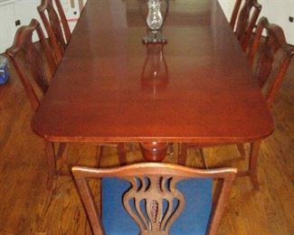 Dining Room: A vintage mahogany double-pedestal table is priced with six mahogany chairs. The table measures: 62" x 40" with two 18" leaves (for a total of 98" x 40" when totally extended). It is shown now with one leaf inserted. Table pads are included.