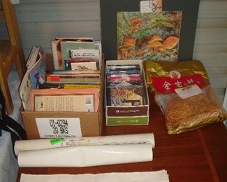 Screened Porch: Mushroom books, posters, CDs a colorful towel, and dried mushrooms in a bag are shown.
