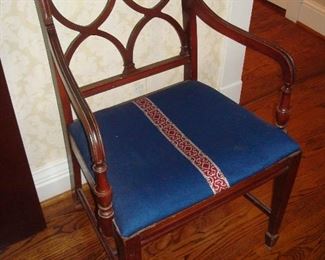Dining Room: This is one of two vintage mahogany chairs that have a little different design from the six dining chairs. There is one arm chair and one side chair. They were covered in the same seat fabric that matches the dining chairs to allow for a total of eight chairs when company arrives. The two chairs are priced separately from the other six.