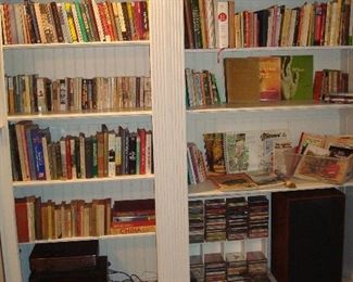 Family Room: These bookcases include numerous books, including themes like: St. Louis & Missouri State; cookbooks (including many vegetarian); novels; gardening; birds; and more! Also shown are CDs, DVDs and a few record albums; as well as a SONY Digital/Audio/Video Control Center (Digital Cinema Sound-Cinema Studio EX) + one remote AND a SONY 5-Disc Changer (CDP-CE345) + one remote. One of two JBL speakers is also shown.
