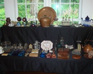 Family Room: Many collectibles: paperweights; a large copper jug made by the client's great-grandfather in Russian in the mid-1800's; a copper platter wall hanging; vintage electric insulators; glass violin bottles; vintage bottles (including a pint milk bottle from the Chester, Illinois dairy); a flow blue Staffordshire-style Toby judge teapot; and more. Some closer photos follow.