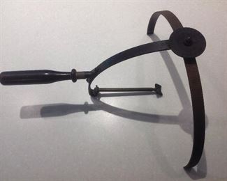 Family Room: an antique optical hand held perimeter is a novel gift for an optician (Maxine's grandfather was an optometrist many years ago). An arc perimeter was used to measure the angle of extent of a patient’s visual field by moving targets along the arc until they could no longer be seen. The doctor would then record the results.