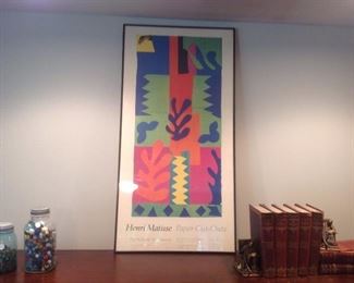 Living Room: A tall framed vintage poster (22" x 44") from a 1970's Henri Matisse exhibit at the St. Louis Art Museum is in between two vintage Ball jars filled with marbles and a set of antique books (see next photo).