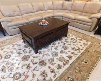 Natuzzi Leather reclining sofa and area rug