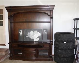 The tires are Toyo Open Country.   R/T  35 *12.5. R22,   There are four of them.  The large entertainment is from Havertey's Furniture.  The entertainment unit is sold.  The tires are unsold.  PLEASE NOTE>