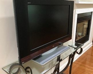 Nice TV and glass and iron table