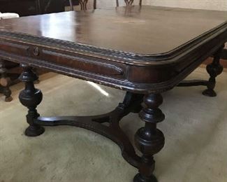Vintage pre-1930's dining room table with removable leaf.  Has some scratches that can be refinished.  Overall condition is good and sturdy.  Comes with 8 chairs.  Price negotiable.   