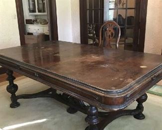 Vintage pre-1930's dining room table with removable leaf.  Has some scratches that can be refinished.  Overall condition is good and sturdy.  Comes with 8 chairs.  Price negotiable.    