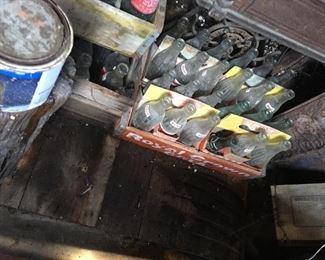 Vintage soda pop bottles in wooden crates