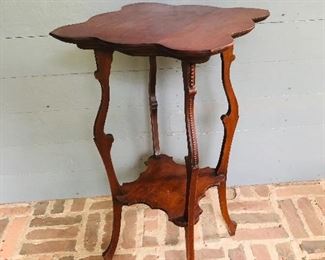 Antique scalloped edge table with long tapering splayed legs, table is lightly constructed circa 1910. 