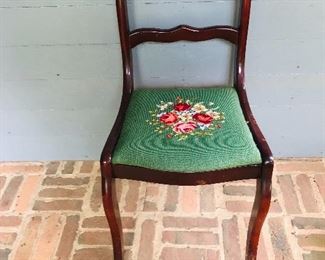 Duncan Phyfe rose back dining /accent side chair featuring a floral needlepoint seat and carved floral details on the back.
