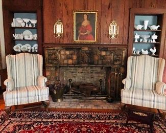 A pair of queen anne wingback chairs and one of many oriental rugs