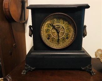 1890 black mantel clock/brass bezel/ main  springs good/8 day/cathedral gong/American made/has key